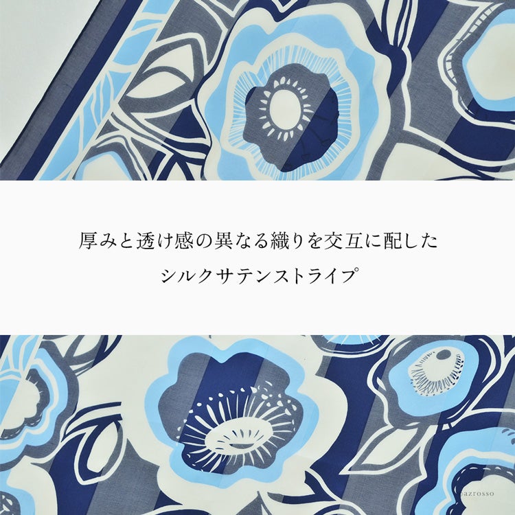 シルク100％の花柄スカーフを広げた生地の拡大。厚みと透け感の異なる織りを交互に配したサテンストライプ