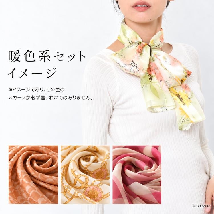 淡い黄色とオレンジの花柄スカーフを白いトップスに合わせた、暖色系セットの着用イメージ