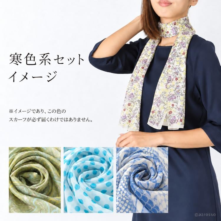 淡い花柄の長方形スカーフを紺色のワンピースに合わせた、寒色系セットの着用イメージ